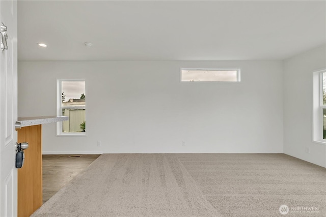 empty room featuring recessed lighting and plenty of natural light