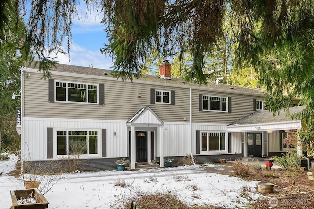 view of front of home featuring a chimney