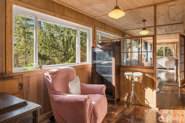 sunroom featuring a wealth of natural light and wooden ceiling