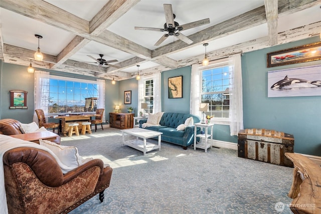 living area with beam ceiling, baseboards, coffered ceiling, and carpet floors