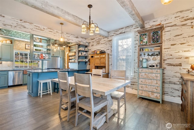 dining space featuring hardwood / wood-style floors, baseboards, beam ceiling, an inviting chandelier, and wood walls