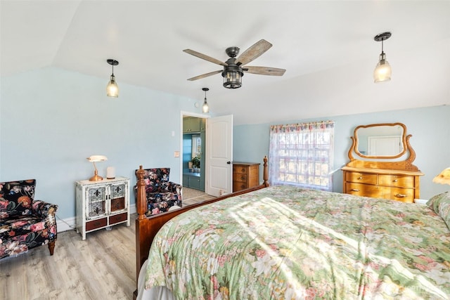 bedroom with lofted ceiling, wood finished floors, and ceiling fan