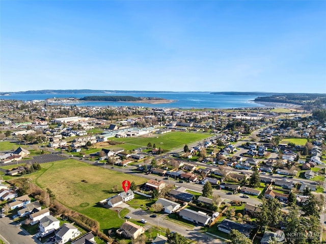 bird's eye view with a water view and a residential view