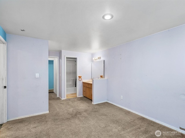 unfurnished bedroom featuring visible vents, baseboards, and light carpet