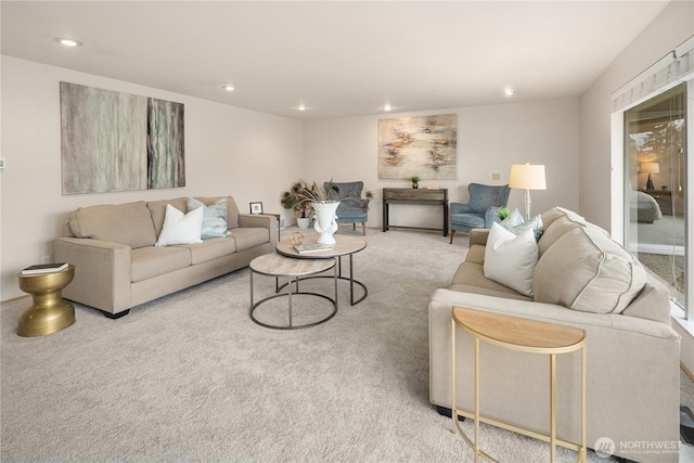 carpeted living area featuring recessed lighting