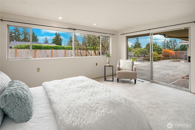 bedroom with access to exterior, carpet flooring, and recessed lighting