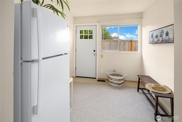 doorway to outside featuring visible vents