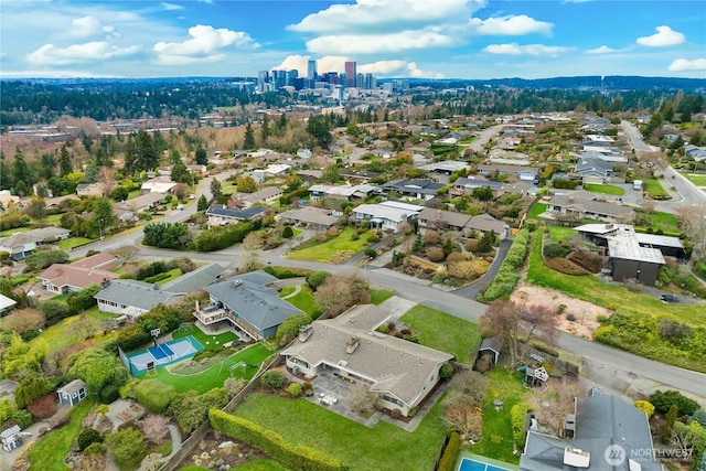 birds eye view of property with a residential view