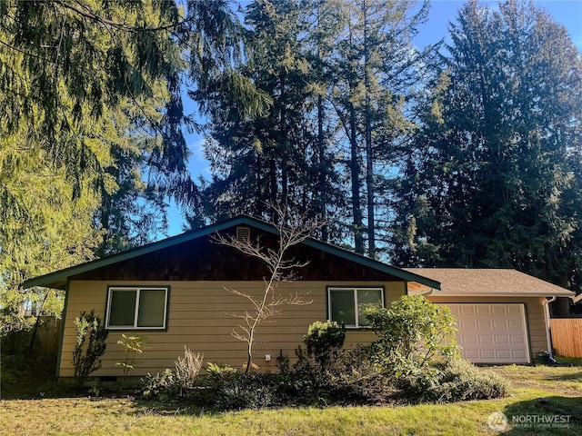 view of side of property with a garage