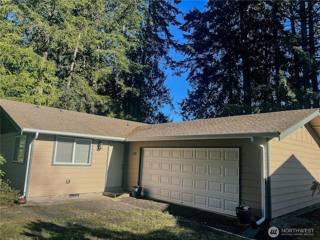 single story home featuring crawl space, a garage, and a shingled roof