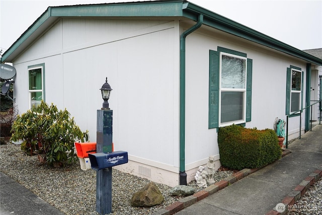 view of home's exterior with crawl space