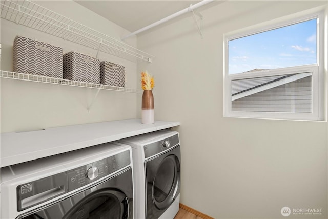 washroom featuring laundry area and washer and dryer