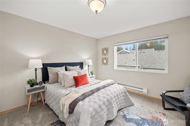 bedroom featuring carpet flooring, a baseboard heating unit, and baseboards