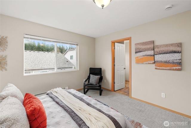 carpeted bedroom featuring baseboards