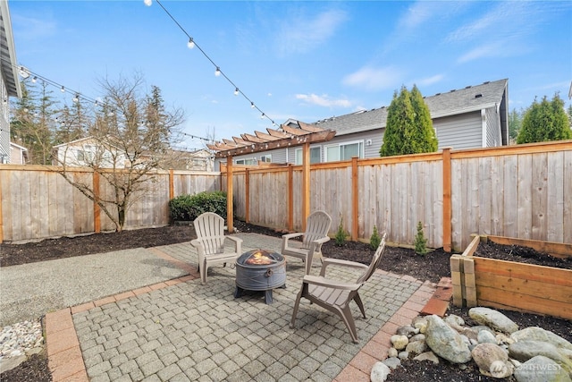 view of patio / terrace featuring a fenced backyard and an outdoor fire pit