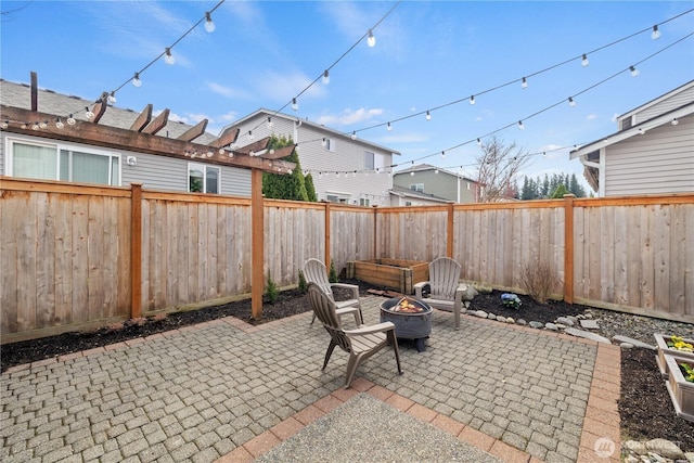 view of patio / terrace featuring a fenced backyard and an outdoor fire pit