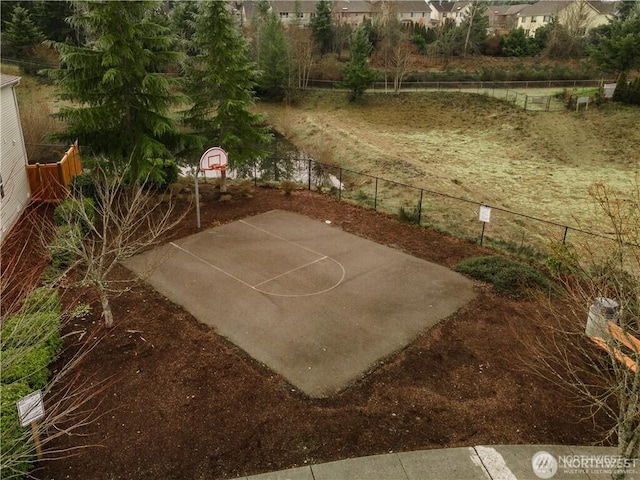 view of sport court with fence and basketball court