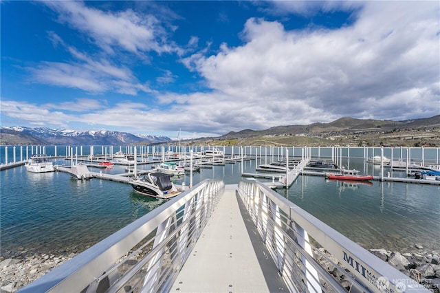 dock area featuring a water and mountain view