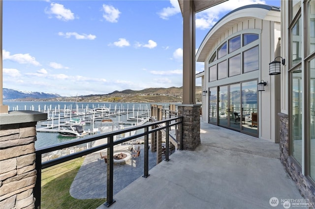 balcony with a water and mountain view