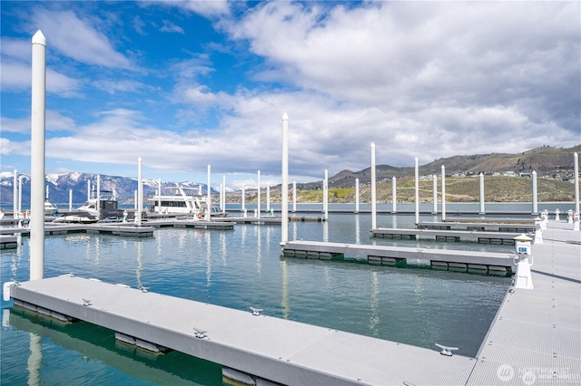 dock area featuring a water and mountain view