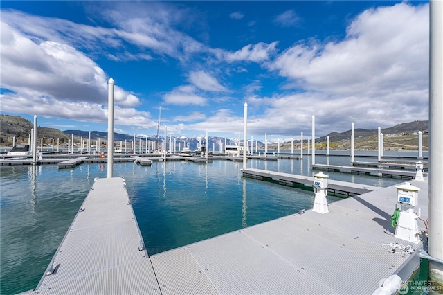 dock area featuring a water and mountain view