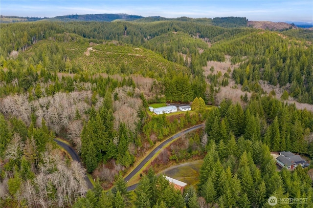 aerial view with a wooded view