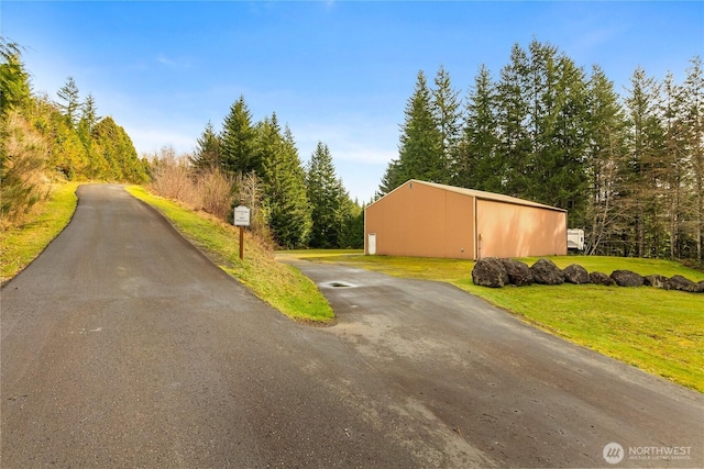 view of street featuring an outbuilding