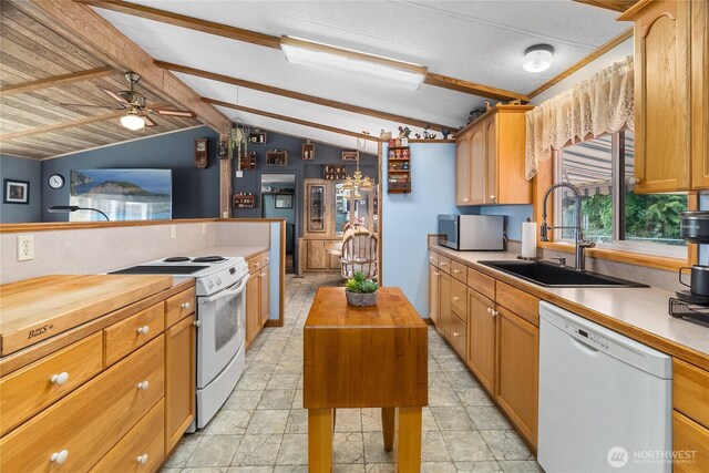 kitchen with a sink, white appliances, vaulted ceiling with beams, and wood counters