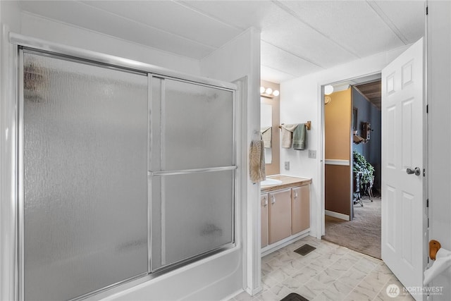 bathroom featuring vanity and combined bath / shower with glass door