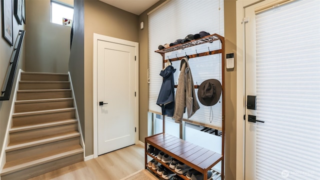 mudroom with light wood-style floors