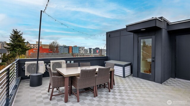 view of patio featuring outdoor dining space and a balcony