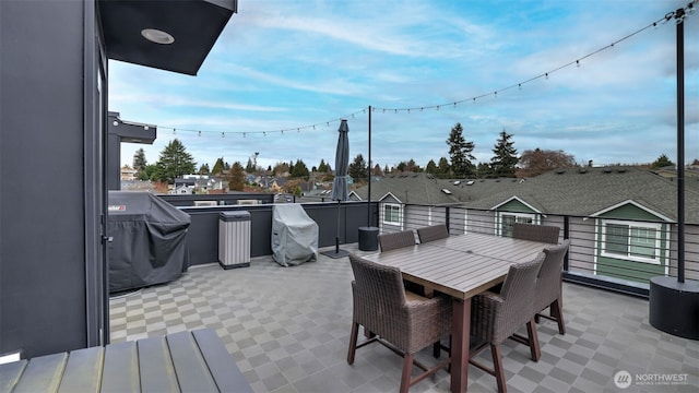 view of patio / terrace with area for grilling, outdoor dining area, and a balcony