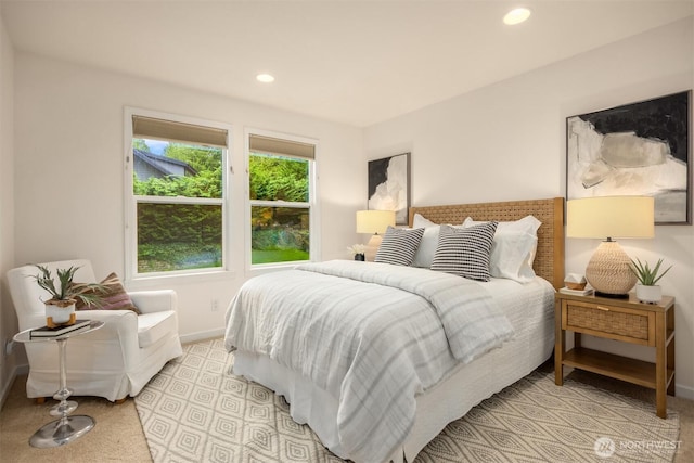 bedroom featuring light carpet, recessed lighting, and baseboards