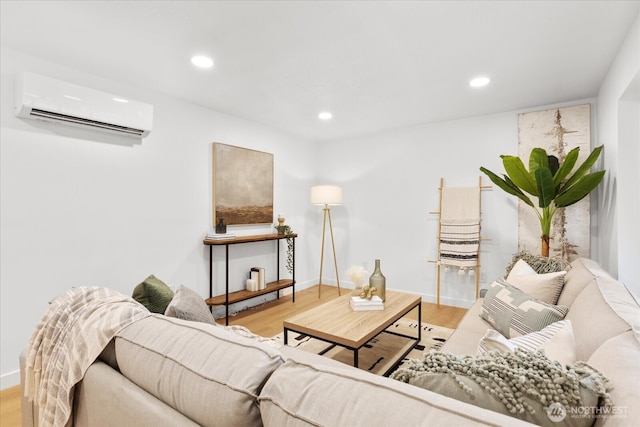 living area with recessed lighting, wood finished floors, baseboards, and a wall mounted air conditioner