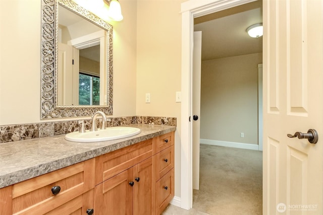 bathroom featuring vanity and baseboards