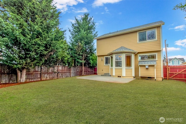 rear view of house featuring crawl space, a lawn, a fenced backyard, and a patio area