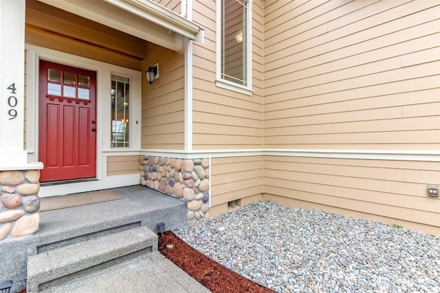 view of exterior entry featuring crawl space