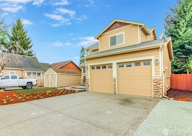 exterior space with concrete driveway and fence