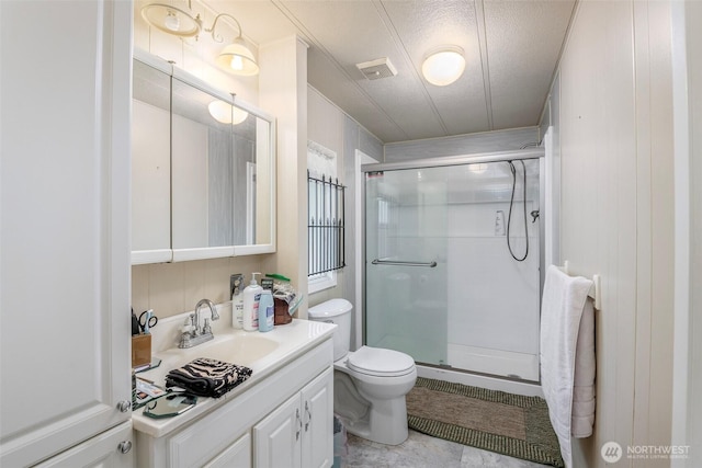 full bath featuring visible vents, toilet, a stall shower, and vanity