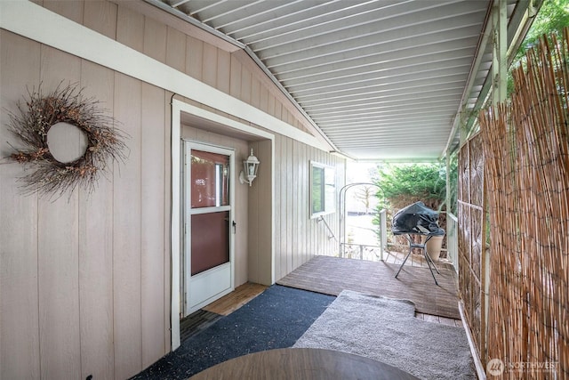 doorway to property with a wooden deck