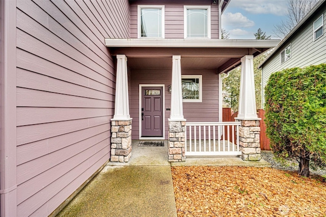 entrance to property featuring a porch