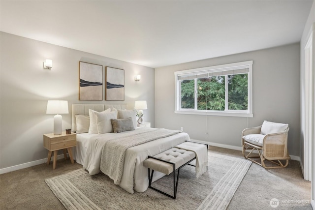 carpeted bedroom with baseboards