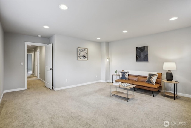 living area with recessed lighting, light colored carpet, and baseboards