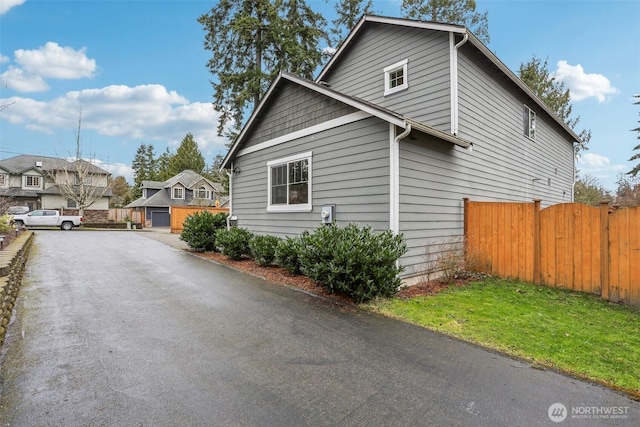 view of side of property with fence