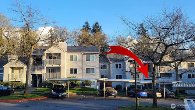 975 Aberdeen Ave NE Unit F407, Renton, WA 98056 - view of property with covered and uncovered parking
