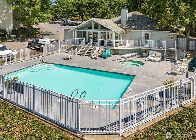 975 Aberdeen Ave NE Unit F407, Renton, WA 98056 - community pool featuring a community hot tub, a patio, fence, a wooden deck, and stairs