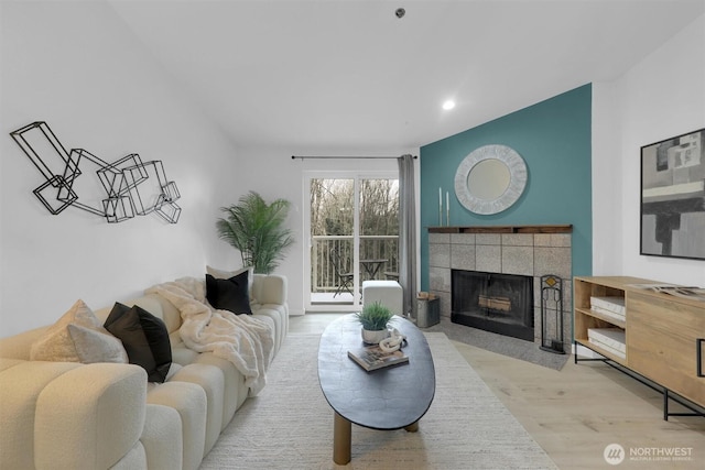 975 Aberdeen Ave NE Unit F407, Renton, WA 98056 - living room featuring recessed lighting, wood finished floors, and a tile fireplace