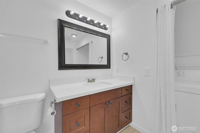 975 Aberdeen Ave NE Unit F407, Renton, WA 98056 - bathroom featuring vanity, toilet, and washer / clothes dryer