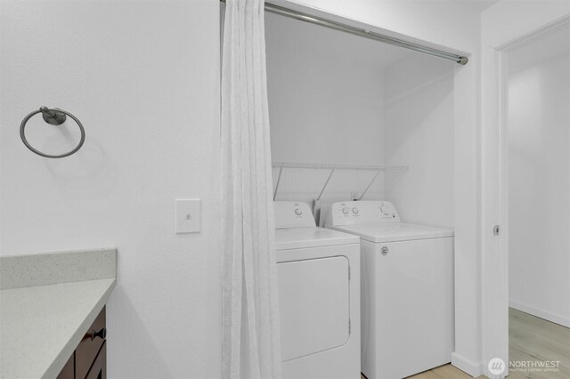 975 Aberdeen Ave NE Unit F407, Renton, WA 98056 - laundry room with laundry area, washer and dryer, and light wood-style floors