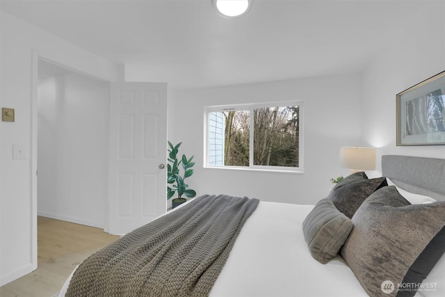 975 Aberdeen Ave NE Unit F407, Renton, WA 98056 - bedroom featuring baseboards and wood finished floors